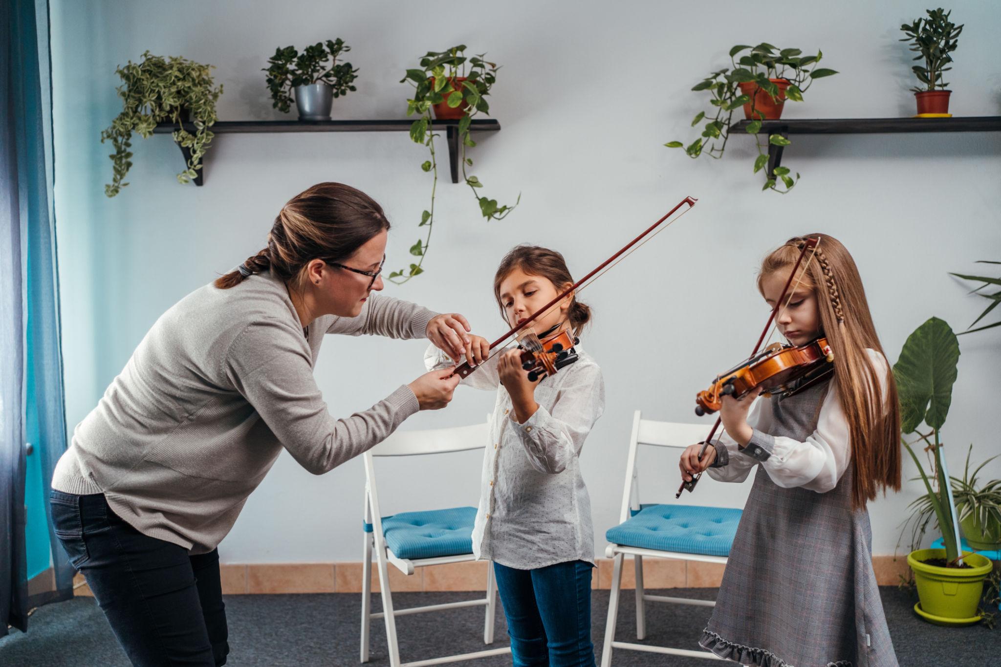 Children participating in a collaborative music learning activity