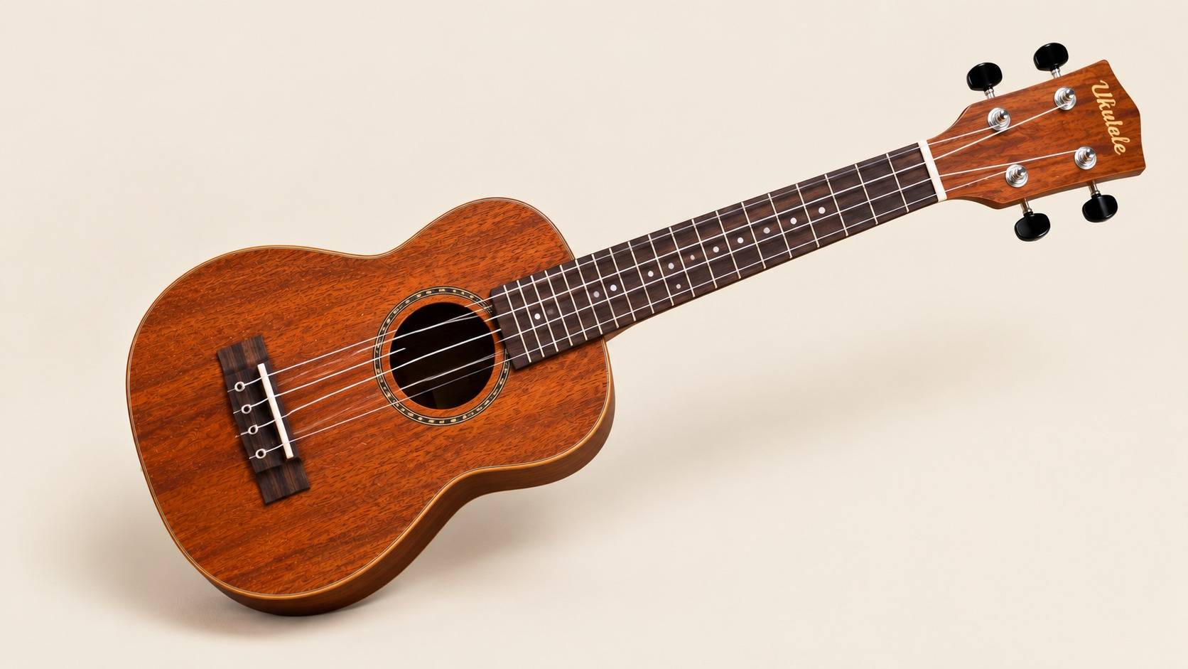 Close-up of a wooden ukulele showing its strings and sound hole