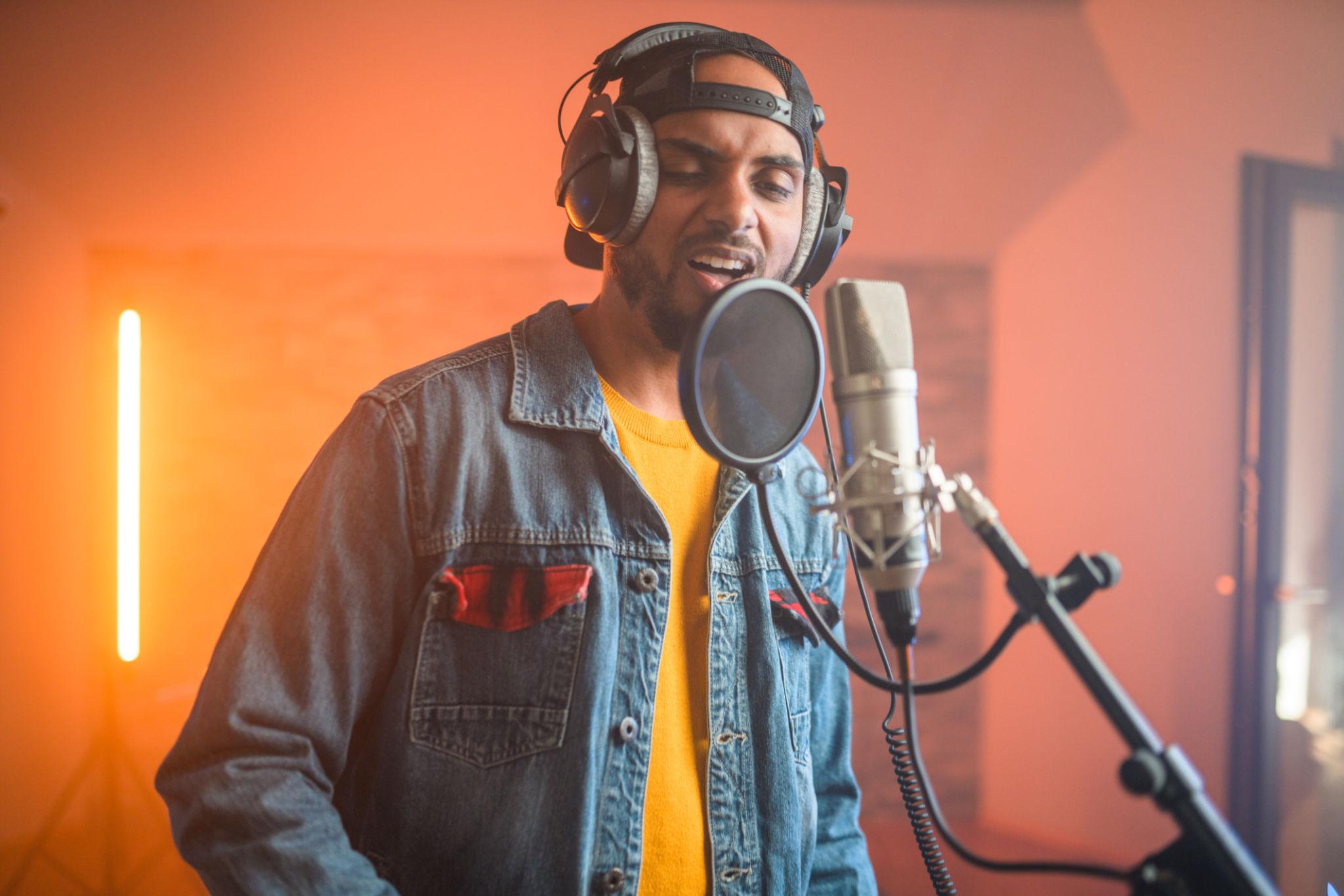 Recording beats and producing rap music in a studio environment