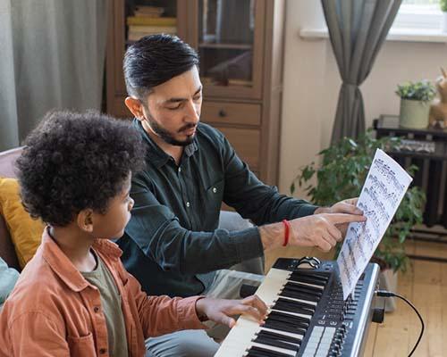 Musician creating an original musical idea during a focused composition session