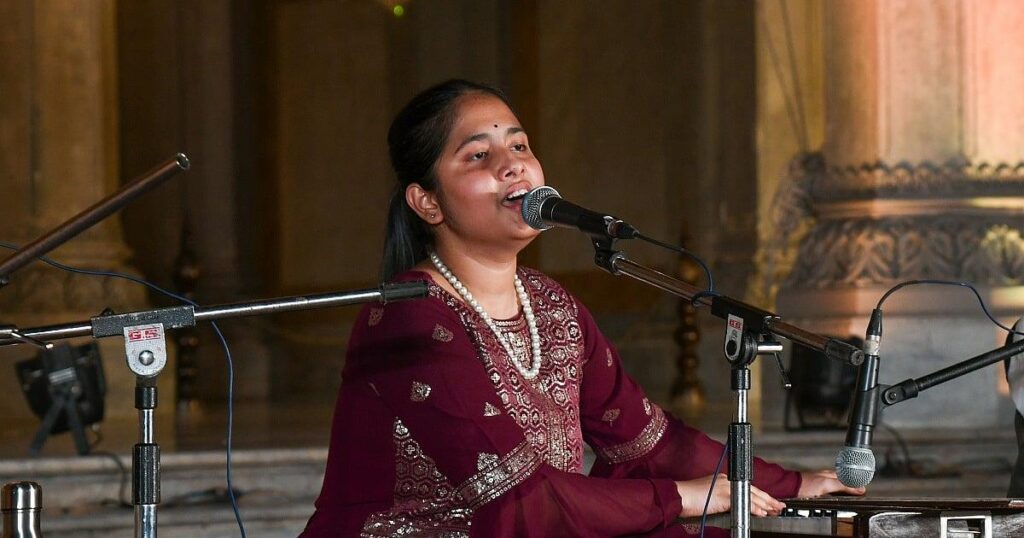 Singer performing light music with a microphone in a music studio